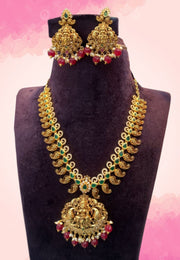 Traditional short haram with green stone and ruby colour stone and God laxmi motive pendant
